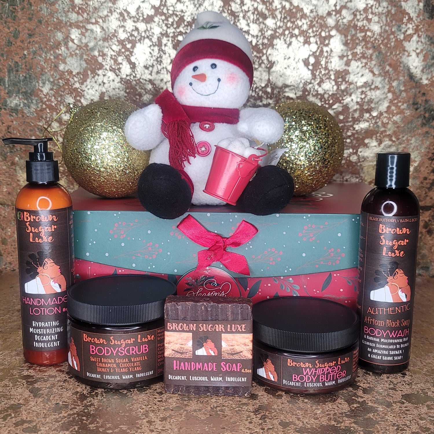 Brown Sugar Luxe Full & Fabulous Christmas Gift Set paired with Stuffed Skiing Snowman