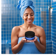 Lady in Shower holding Blueberry Thrill Whipped Body Butter