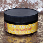 Jar of Sunkissed Glow Turmeric Whipped Body Butter on a textured surface